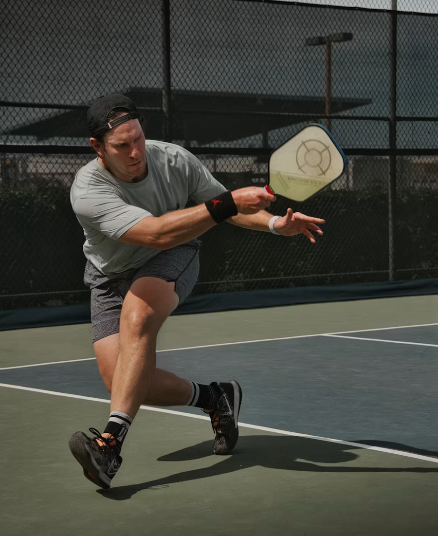 Individual playing pickleball